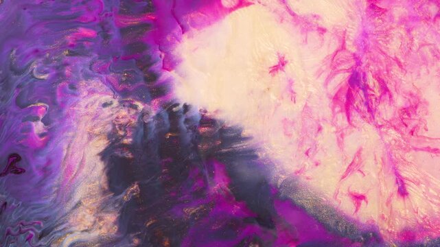 The close up of a painting on the wall features a mix of purple, pink, and magenta colors creating a vibrant and colorful pattern of petals