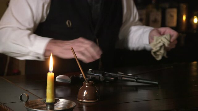 1880s man removes bullets focus on inkwell