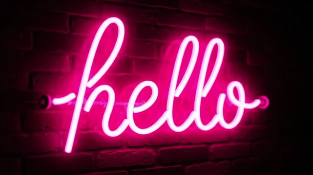 Pink neon hello sign on a dark brick wall