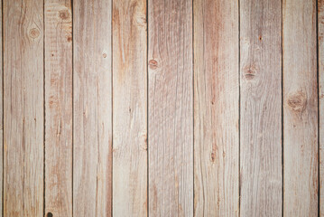 Obraz premium vertical texture of an old fence made of unpainted wooden planks with knots and cracks