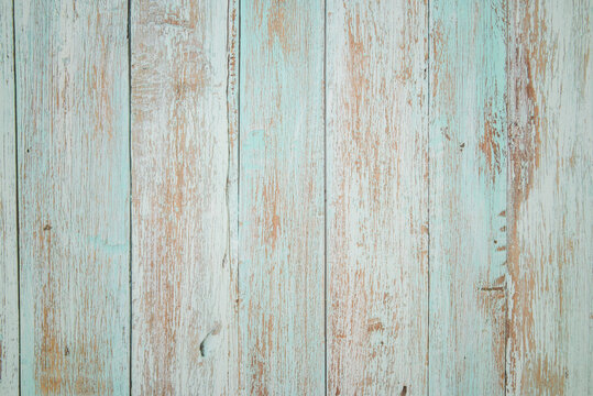 aged turquoise wooden texture with heavy scuffs and showing through natural wood grain