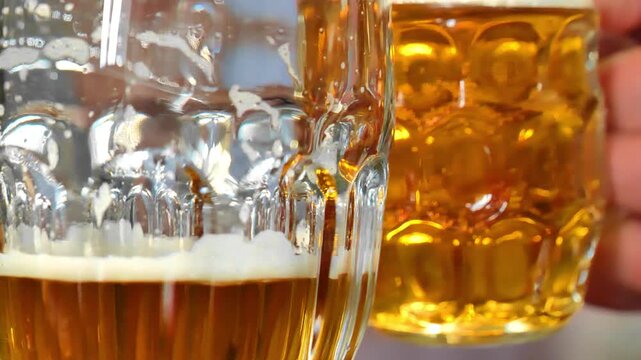 Oktoberfest beer culture. drinking beer. They are checking in with their beer mugs. 4k footage