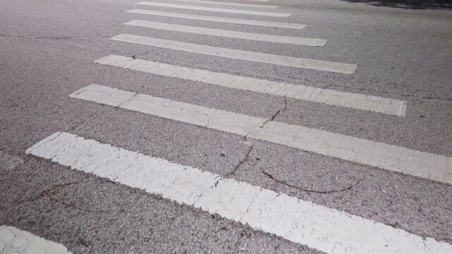 pedestrian crossing on the road walking in a crosswalk