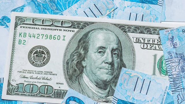 Close-up of Brazilian one hundred real banknotes arranged as a money background, representing finance, economy, banking, wealth, investment, inflation, business, savings, and financial concepts in Bra