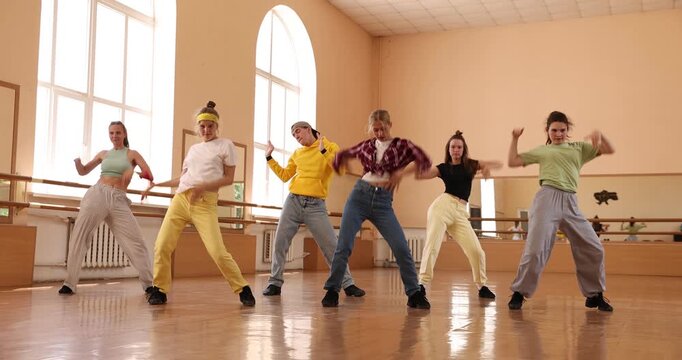 Group of dancers practicing dance moves in studio