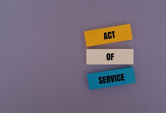 Colorful blocks with the text "ACT OF SERVICE". Relationship love language and customer support concept