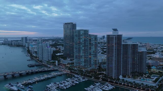 Luxury South beach marina. Luxury yacht. Miami south beach view. Yacht club. Marina in Miami, Florida on sunset. Tropical waterfront sunset. Miami marina with luxury yacht. Summer sunset vacation