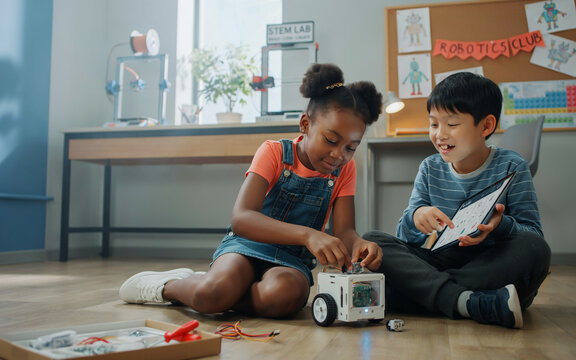Diverse Kids Programming Robot in STEM Classroom | Elementary School Children Learning Robotics, Coding, and Technology Education in Modern Science Lab