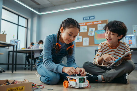 Diverse Kids Programming Robot in STEM Classroom | Elementary School Children Learning Robotics, Coding, and Technology Education in Modern Science Lab