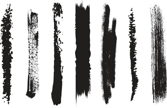 Set of black ink brush strokes and paint textures on a white background