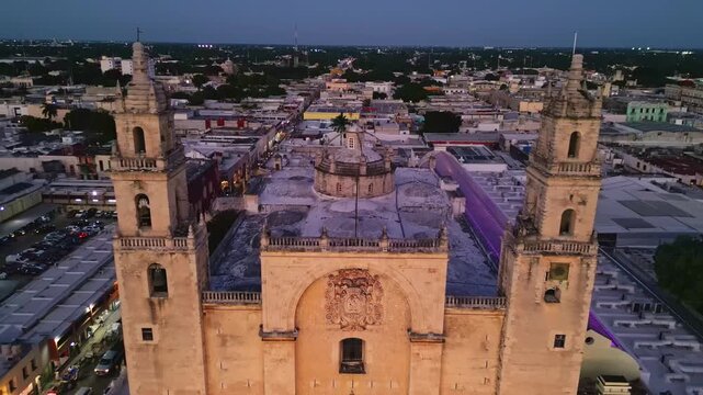 Merida Cathedral facade flying into a top down view