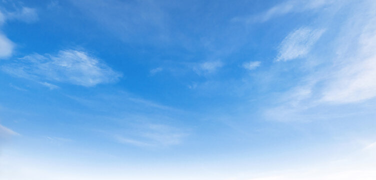 Clear blue sky with wispy clouds above