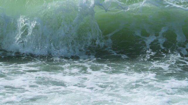 Slow motion footage of sea waves crashing on the shore