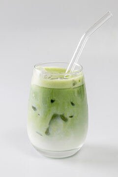 Iced matcha latte on a white background.