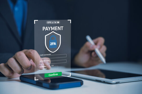 Business professional confirms a secure online payment using two-factor authentication, illustrating mobile banking, credit card protection, cybersecurity, fintech, and transaction verification.