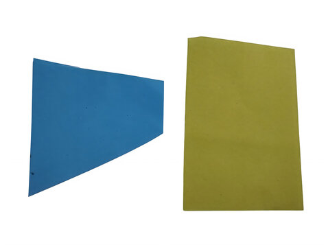 Blue and yellow geometric paper shapes on a flat surface isolated on transparent background