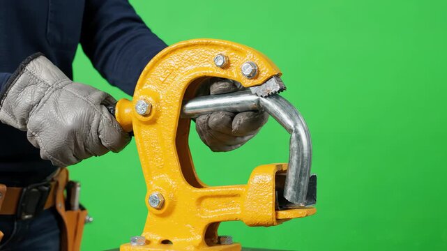 Manual metal conduit bender tool mechanically shaping a steel pipe with smooth motion on a bright green screen background