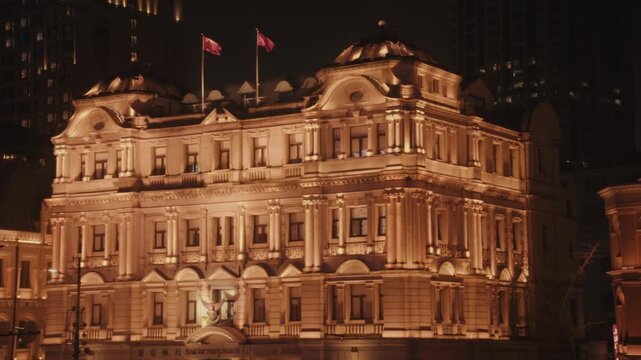 Close night shot of an ornate French Baroque heritage building facade on The Bund, Shanghai.