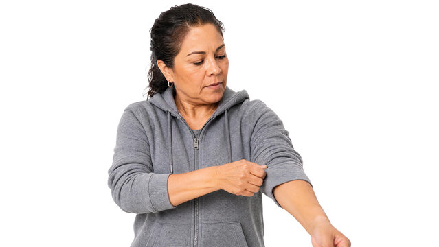 Determined Mature Woman in Grey Hoodie Rolling Up Sleeves for Hard Work Isolated