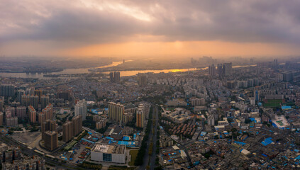 Obraz premium Aerial View of Cityscape and Pearl River Delta at Golden Sunset