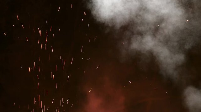 Abstract fire sparks with explosion smoke plumes overlay