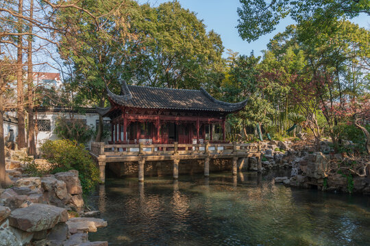 The Nine Lion Study Pavilion on the shore of the pond in the Yuyuan Garden (Yu Garden) on a sunny day, Shanghai, China