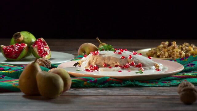 Traditional Mexican chile en nogada served on a plate against a dark background