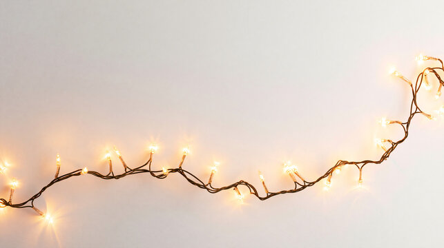 Christmas string lights glowing on white background