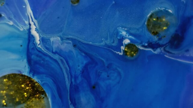 Acrylic blob. Shimmering fluid. Oil glitter spot floating on blue paint liquid surface. Art mix powder pigment fantasy abstract background.