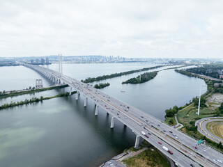 Obraz premium Aerial view of Brossard suburban Montreal skyline beyond the river and bridge. g