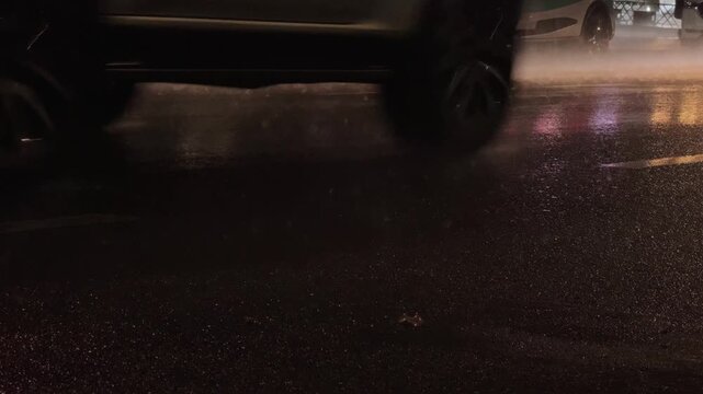 Dense Traffic on a Wet Asphalt City Road at Night During Heavy Rain