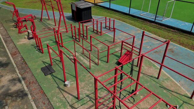 Drone shot of public street workout park with pull-up and parallel bars