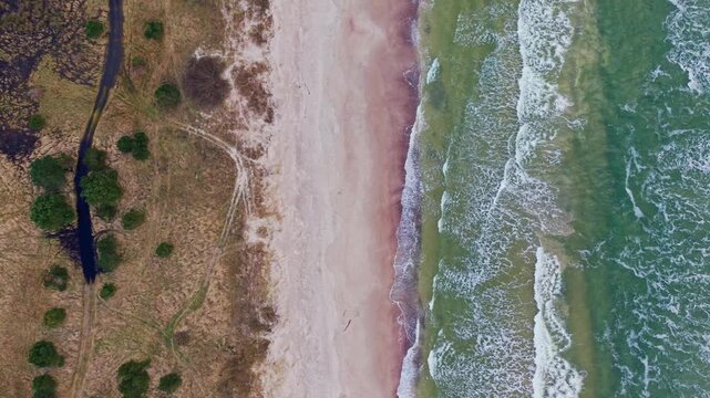 Top Down Drone Flight Along Nida Pebble Beach and Baltic Coastline in Latvia