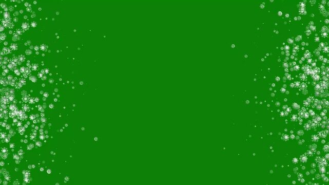 4k dense falling snowflakes and glowing winter particles side borders animation on chroma key green screen background for festive holiday video editing