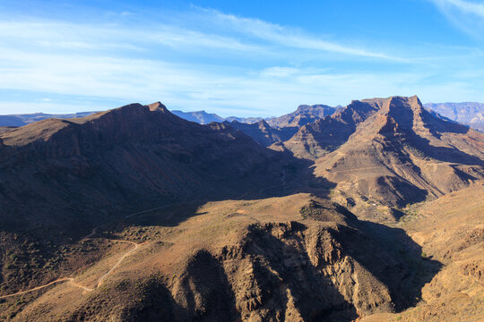 Panorama with mountains and canyon Fataga ravine (Barranco de Fataga) seen from viewpoint Mirador Degollada de las Yeguas on Canary Island Gran Canaria, Spain