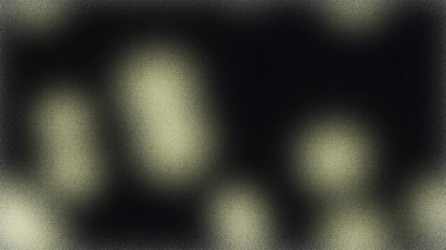 Abstract grainy light flares on dark background
