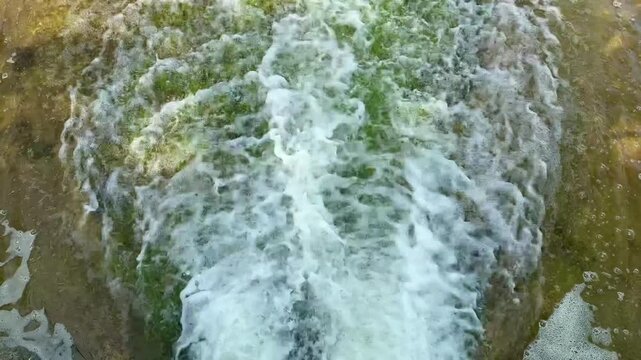 water drop, flowing into the river, close-up, wastewater, fountain system communicating vessels and the law of free fall