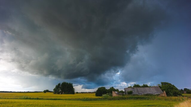 Angry supercell storm influenced by Climate change. Dangerous storm supercell shelf cloud with layers