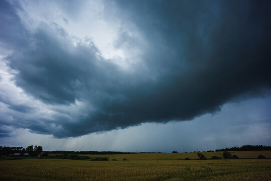 Angry supercell storm influenced by Climate change. Dangerous storm supercell shelf cloud with layers