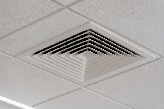 A white ceiling vent with a geometric design is visible indoors.