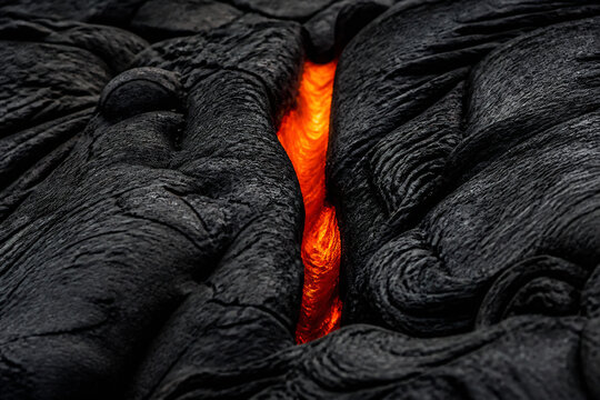 A fiery orange fissure cuts through dark, textured material.