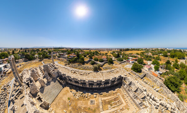 Didim, Turkey. Broad panoramic view of ancient Greek ruins at Didyma showing temple remains and scattered architectural fragments. Aerial view