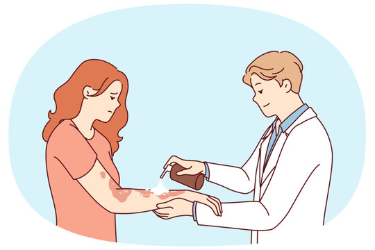 Dermatologist treats eczema on hands of woman suffering from skin disease and pigmentation spots. Man doctor in white coat uses spray for eczema, applied medicinal ointment to body of upset girl