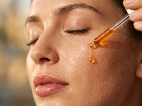Skincare Routine Woman Applying Hydrating Facial Serum with Dropper