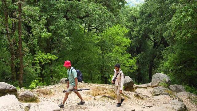 Hikers trekking in forest. People exploring nature, Kareri Lake, Kangra, Himachal Pradesh.