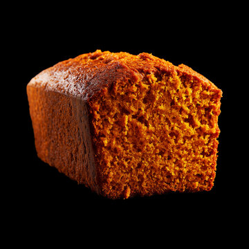 Closeup moist loaf pumpkin cake slice isolated on black background with clipping path, concept of dessert freshness and taste