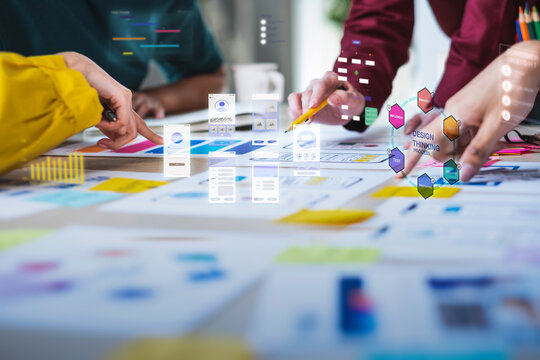 Close up ux developer and ui designer coworkers brainstorm digital marketing, augmented reality, and ux development for mobile, creative, and data-driven teamwork projects
