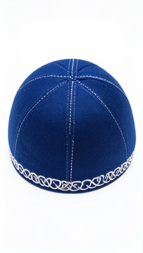 A vibrant blue skullcap with detailed silver trim and stitching