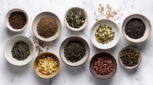 Luxury assortment of loose teas arranged in elegant ceramic bowls including shu pu erh, sheng pu erh, jasmine green tea, oolong, white tea, black