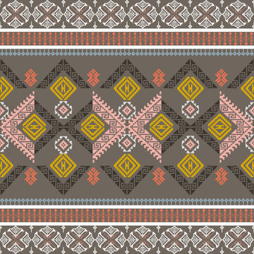 Yellow and brown pixel ethnic boho seamless pattern. Tribal pattern. Cross-stitch pattern, India stitch Kasuti embroidery fabric pattern, and needlework. Quilt wallpapers and textiles.